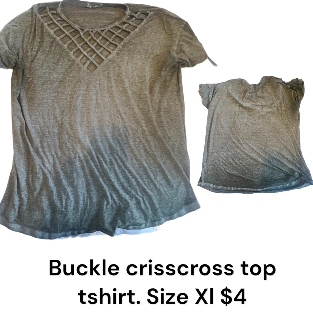 Buckle crisscross top tshirt. Size XI $4. Faded coloring